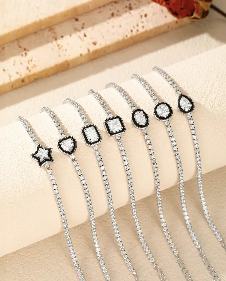 Tennisarmband aus 925 Sterlingsilber mit Zirkonia im schwarzen Rahmen - alle sieben Steinformen nebeneinander