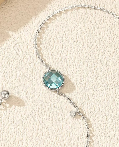 Armband mit blauem Zirkonia - 8 mm Schachbrettschliff an Ankerkette mit Schiebeverschluss, 925 Sterlingsilber