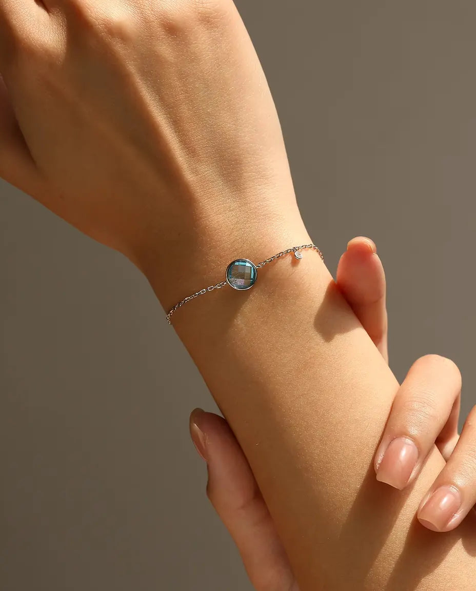 Armband mit blauem Zirkonia - 8 mm Schachbrettschliff an Ankerkette mit Schiebeverschluss, 925 Sterlingsilber