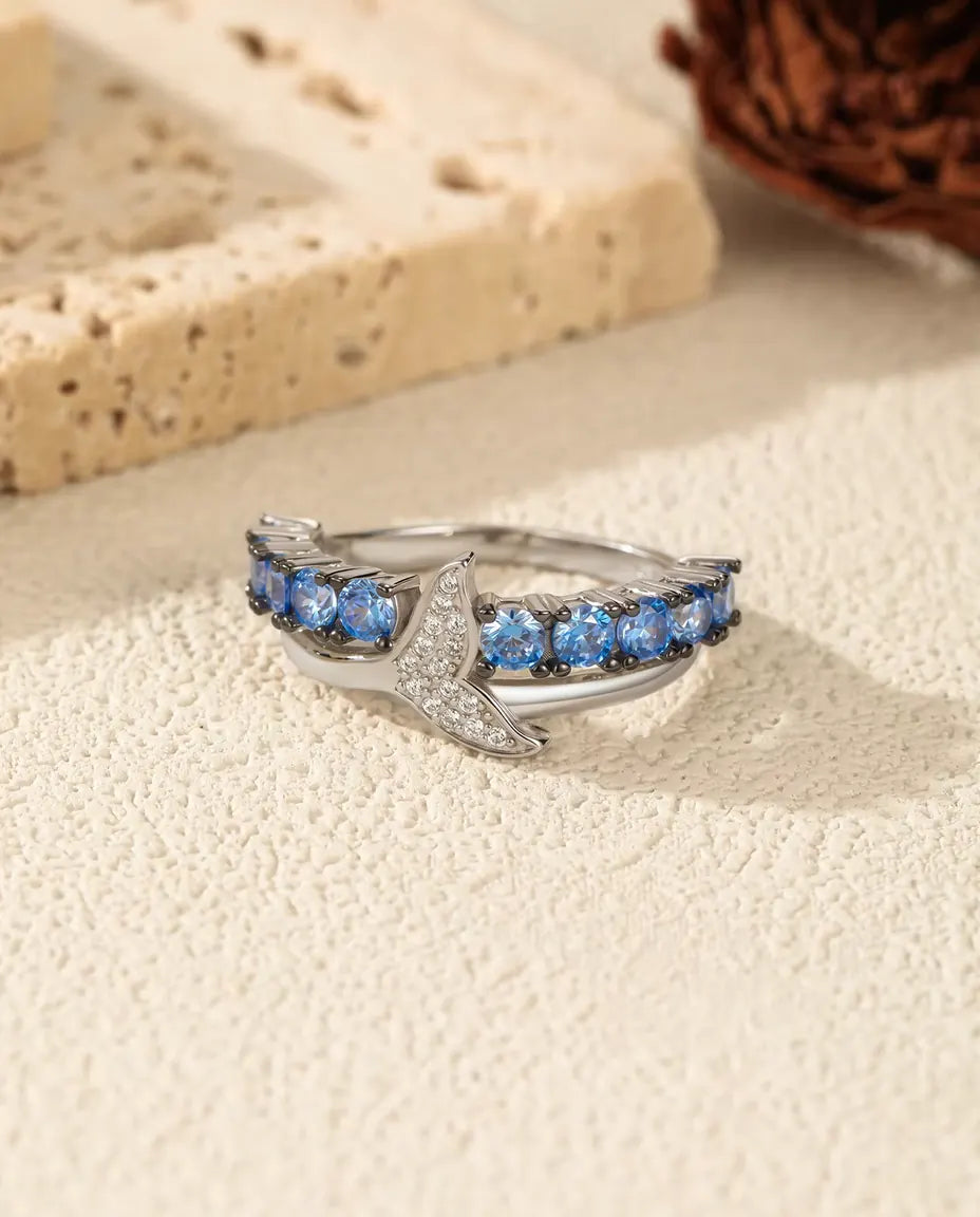 Walflossen Ring - blaue und klare Zirkonia auf gekreuztem Band, Grössen 5 bis 9, 925 Sterlingsilber